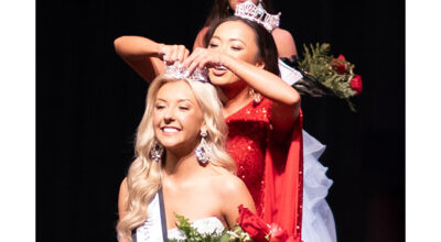 PHOTO BY MARÍA CAMP - Miss RHS 2023, Sarah Morgan, crowns Annie Willis in the 42nd  annual Miss RHS pageant March 1 in the Russellville City Schools auditorium.  