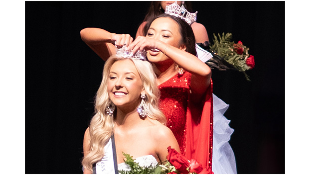 PHOTO BY MARÍA CAMP - Miss RHS 2023, Sarah Morgan, crowns Annie Willis in the 42nd  annual Miss RHS pageant March 1 in the Russellville City Schools auditorium.  